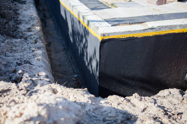Professional Waterproofing technician working in Albany, IN